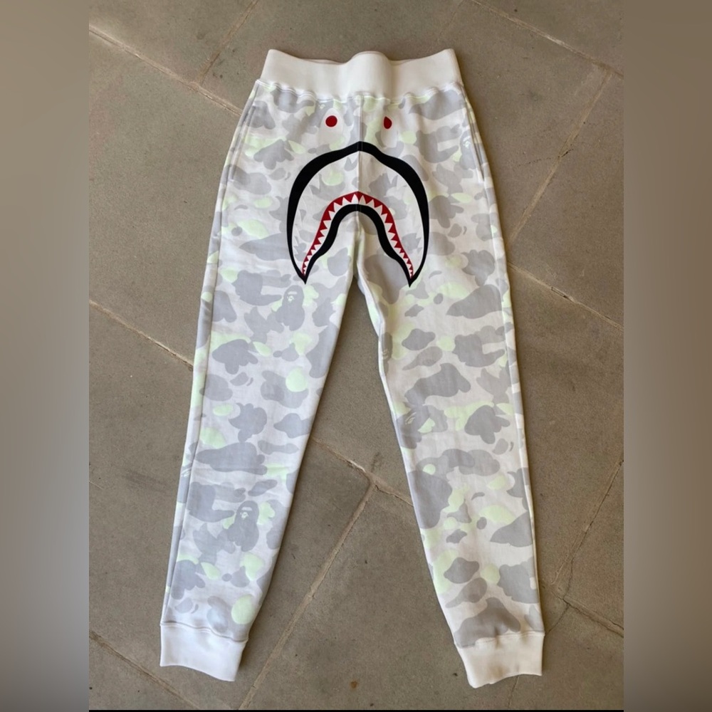 A Bathing Ape City Camo Shark Slim Sweatpants w/ glow in the dark printed ink.